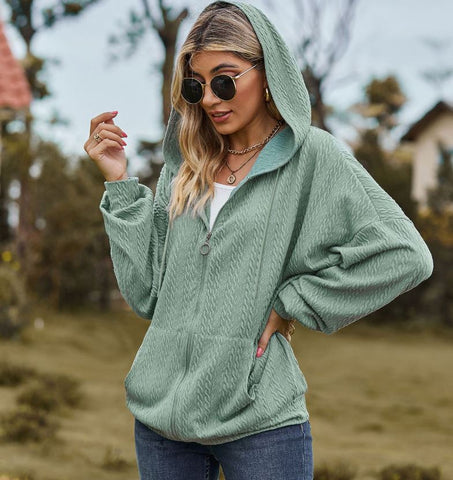 Autumn and winter new solid color pocket long sleeved loose hooded sweatshirt jacket